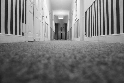 Free Low Angle Photo of Hallway Inside Closed Room Stock Photo