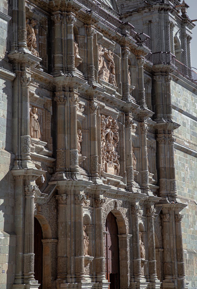 Building Exterior With Sculptures And Statues On Wall