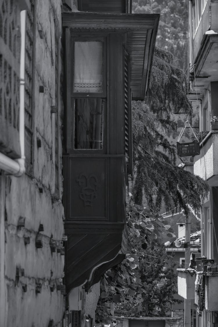 Grayscale Photo Of Wooden Extension In A Building