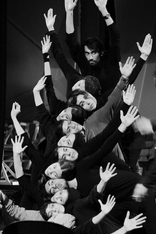 Free A striking black and white image of a group performing a synchronized dance formation. Stock Photo