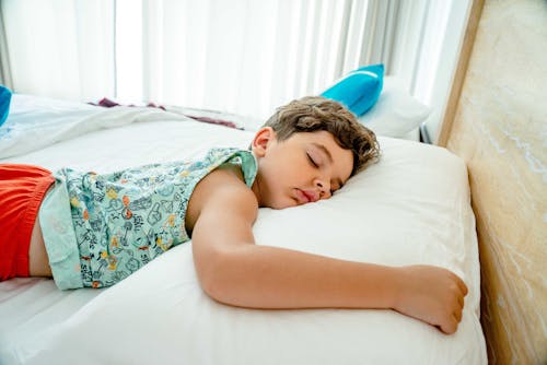 Free Close-Up Shot of Boy Sleeping on a Bed Stock Photo