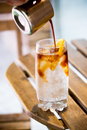 Clear Drinking Glass With Ice and Orange Juice