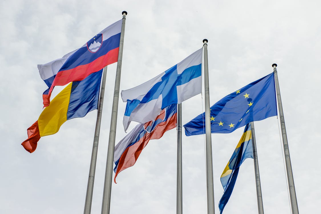 Free Flags of European countries and the EU waving on flagpoles in Strasbourg. Stock Photo