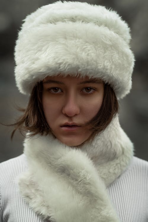 Woman in White Fur Hat and Scarf