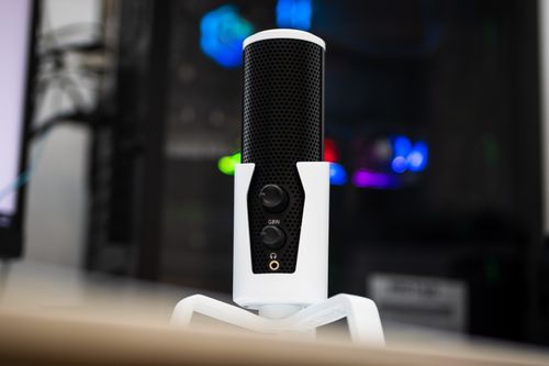 Free High-quality studio microphone with blurred background and vibrant lighting. Stock Photo