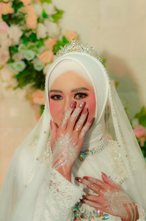 A Beautiful Bride in White Hijab Looking