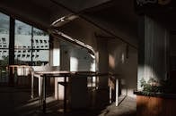 Brown Wooden Table Near the Exit