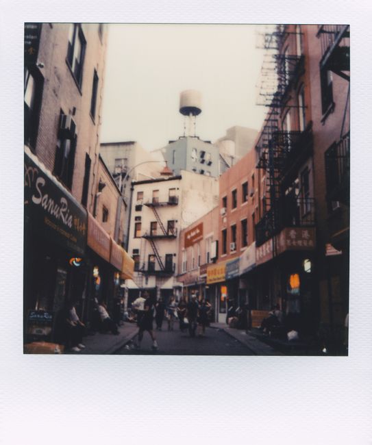 A bustling Chinatown street with vintage aesthetics and urban architecture.