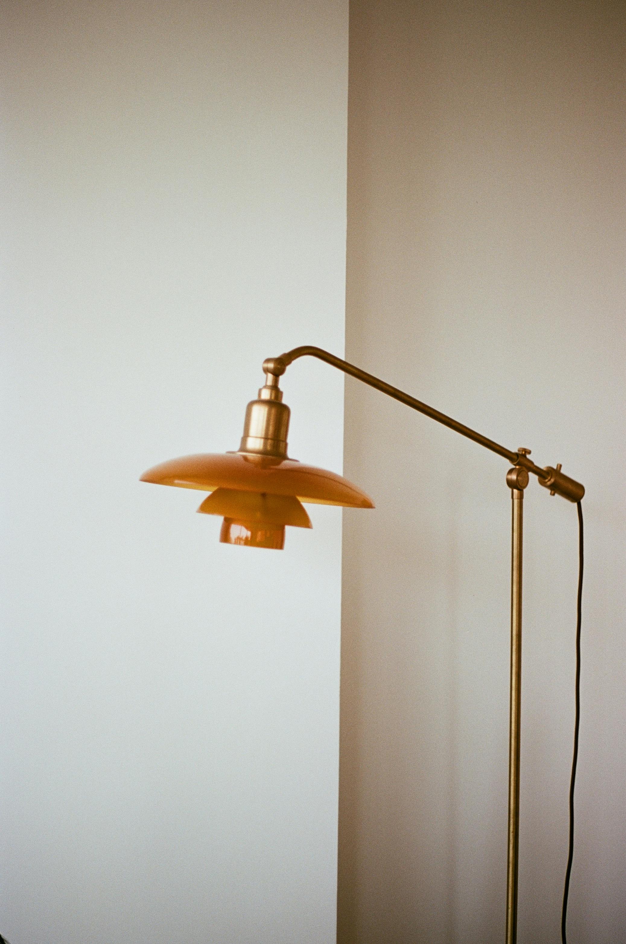 Free Capture of a vintage brass lamp in a modern minimalist home interior, exuding elegance. Stock Photo