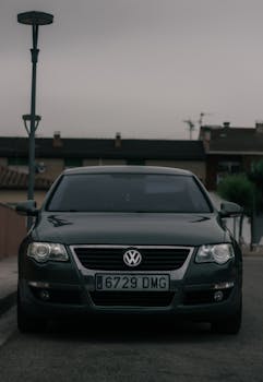 Volkswagen car parked on a residential street in Tarragona, Spain, at dusk.