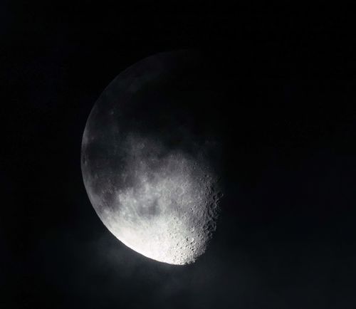 Free Black and white photograph capturing a detailed view of the moon's surface. Stock Photo