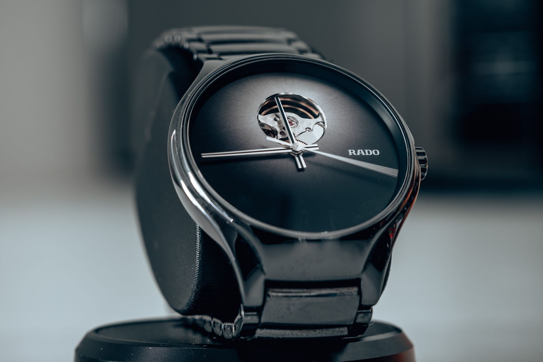 Close-up shot of an elegant black wristwatch showcasing modern luxury design.