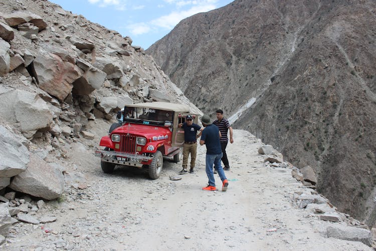 People Talking Outside A Jeep In Gilgit Baltistan, Pakistan