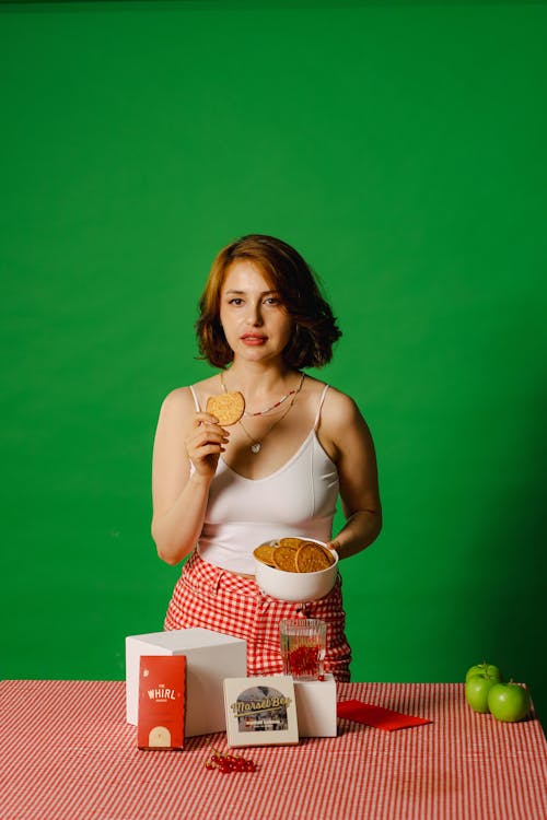 A Woman Holding Brown Biscuit