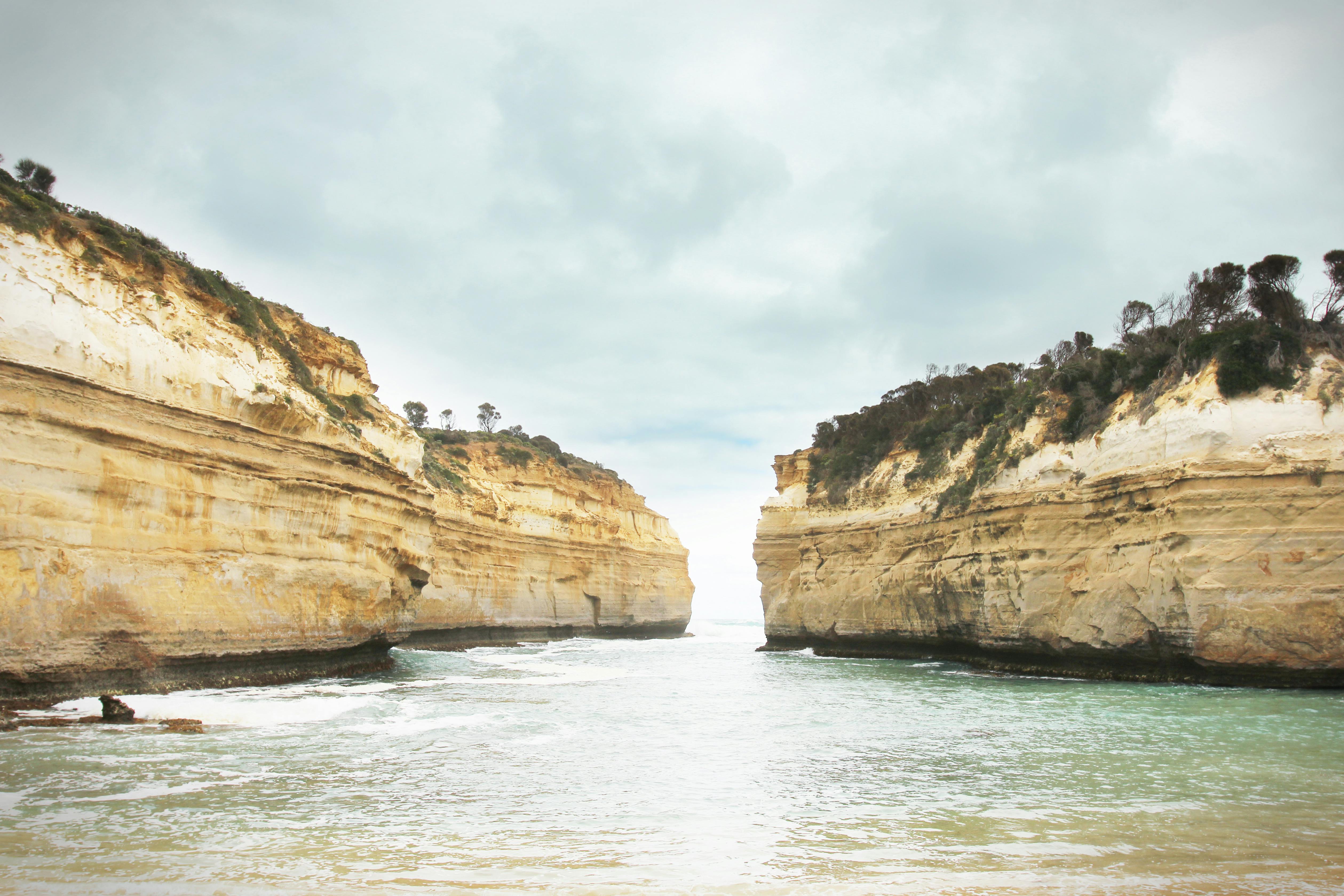 Sea Water between Rock Formations · Free Stock Photo