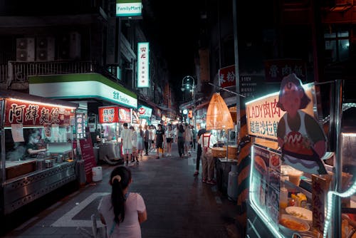 People walking in an Alley of Food Stalls 