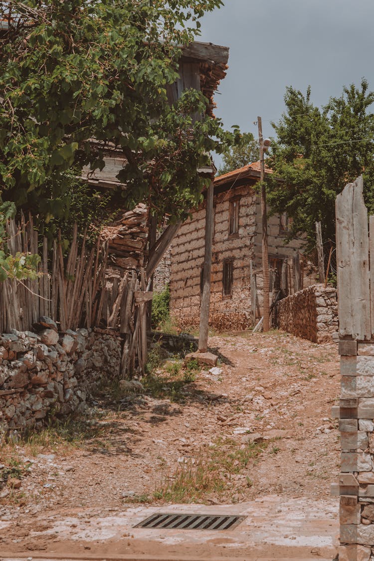 Unpaved Pathway In A Neighborhood 