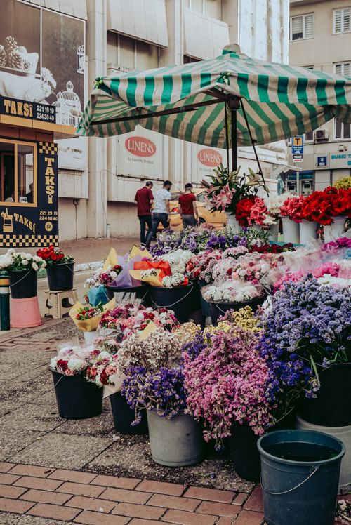Free Colorful floral bouquets displayed at a bustling street market in Bursa, Turkey. Stock Photo