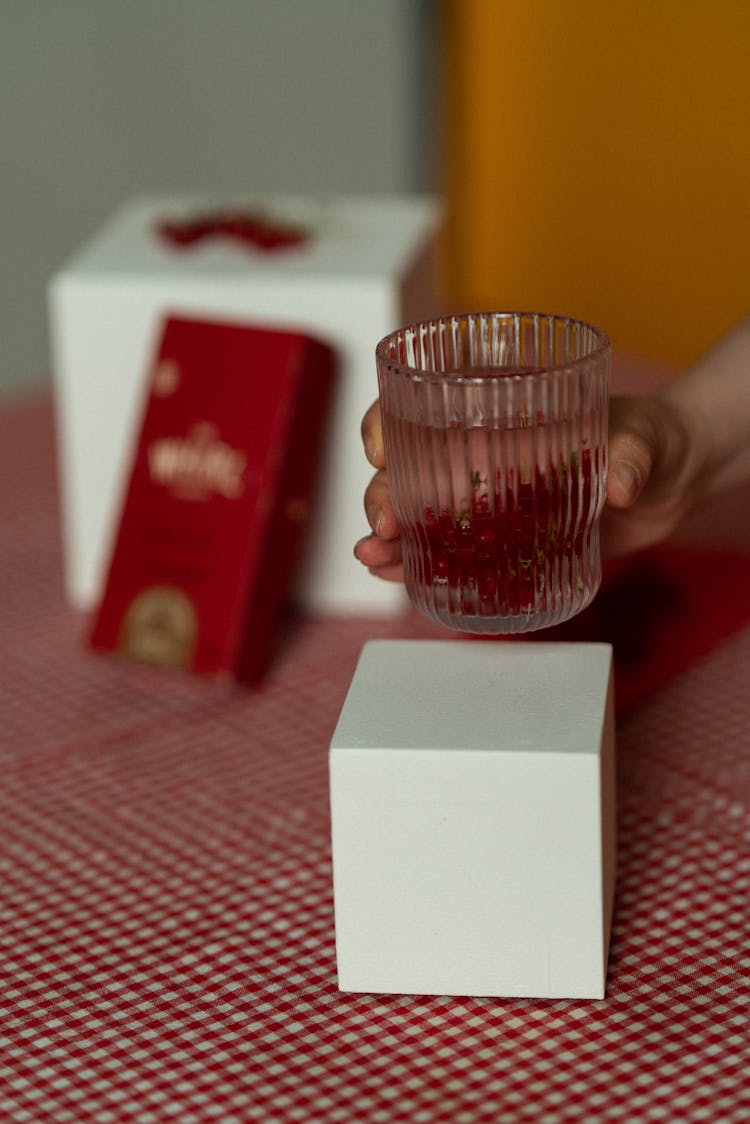 Drinking Glass Held By A Person 