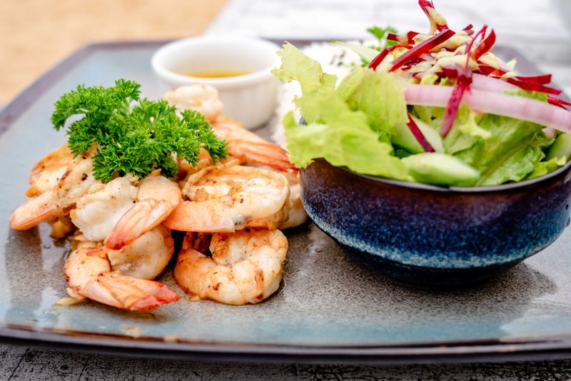 Grilled shrimp served with fresh vegetables