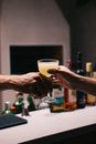 Person Holding Clear Drinking Glass With Brown Liquid