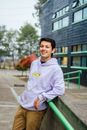 Man in White Hoodie Standing on Sidewalk