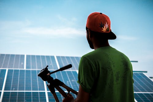 Free Man Facing Solar Panels Stock Photo