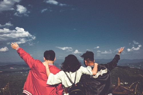 Free A joyful moment with friends overlooking a scenic landscape in Gia Lai, Vietnam. Stock Photo
