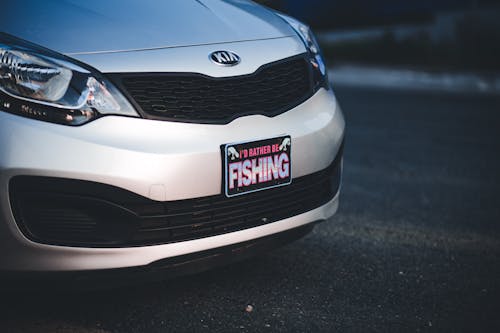 Free White Kia Rio Car on Road  Stock Photo