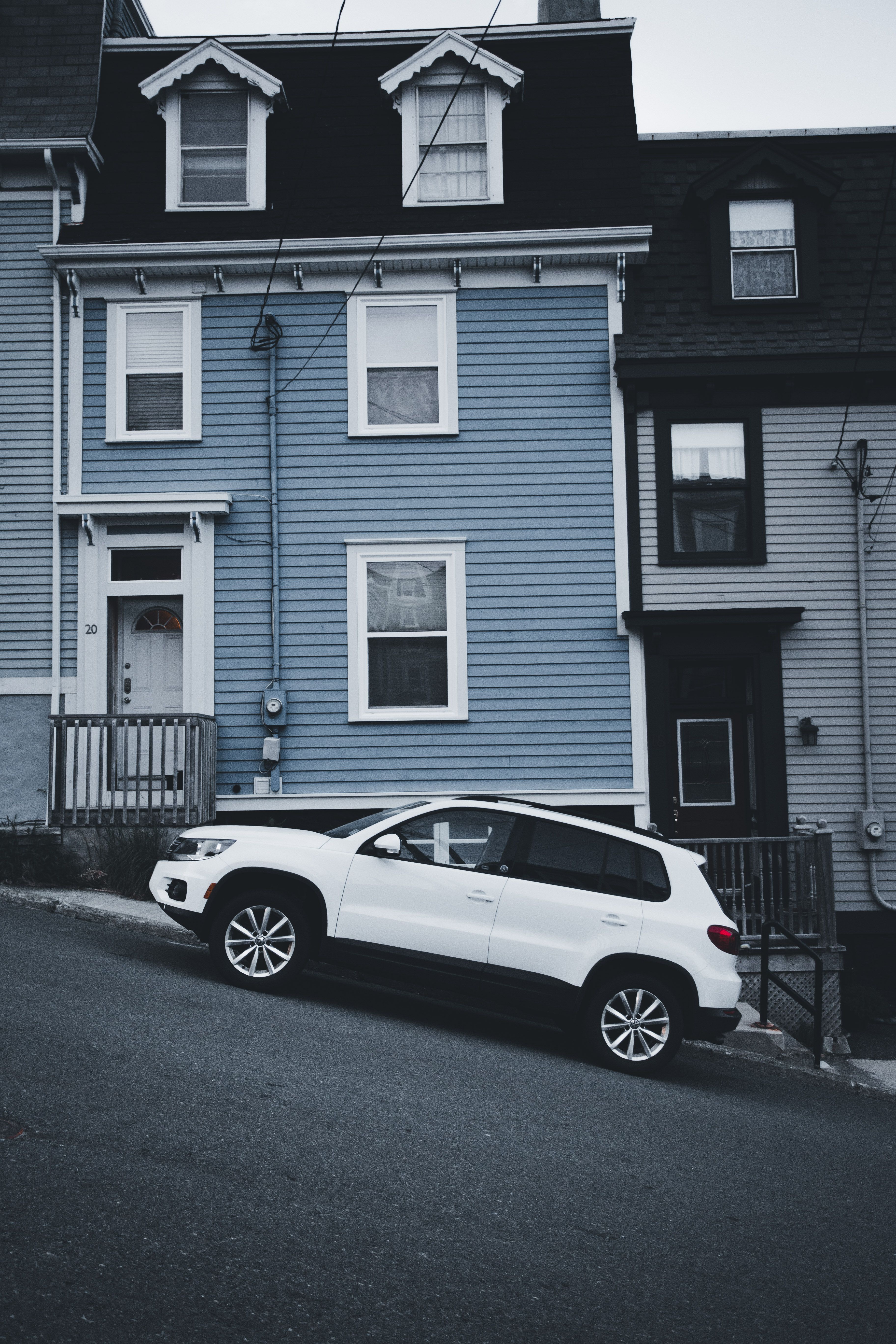 Parked SUV in front of a Wooden House · Free Stock Photo