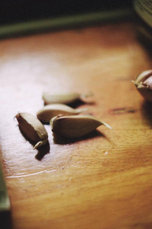 Gloves of Garlic Wooden Surface 