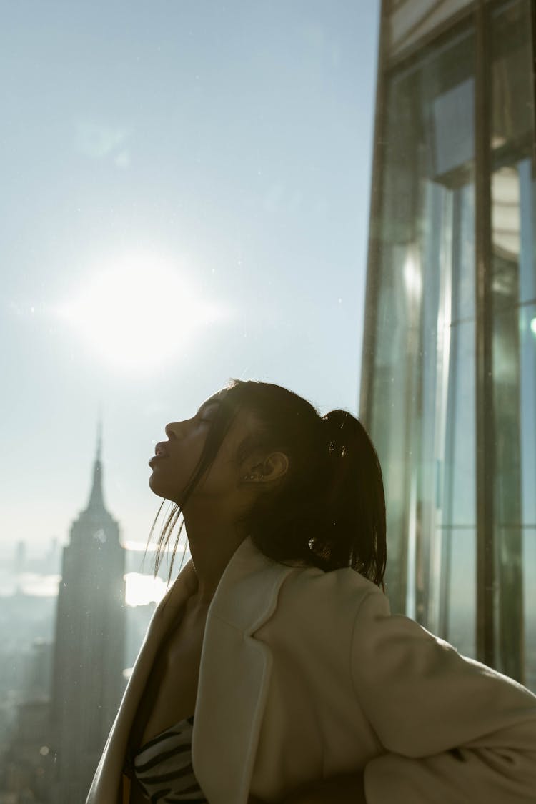 Woman Standing On Top Of Observation Tower