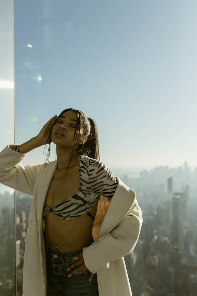 Woman Standing On Top Of Sunny Observation Tower