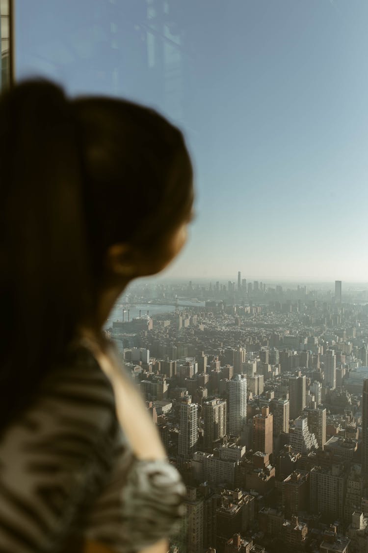 Woman Overlooking City Skyline 