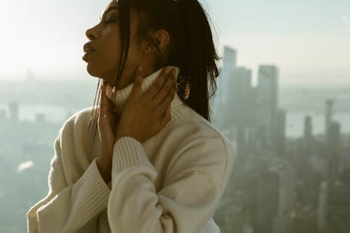 Woman in White Turtle Neck Sweater