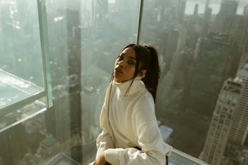 Free Woman Posing on Tower with View of New York City Stock Photo