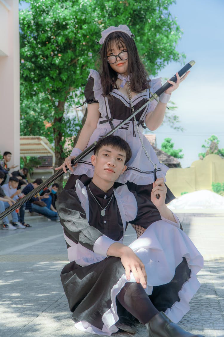 Man And A Woman Wearing Maids Uniform