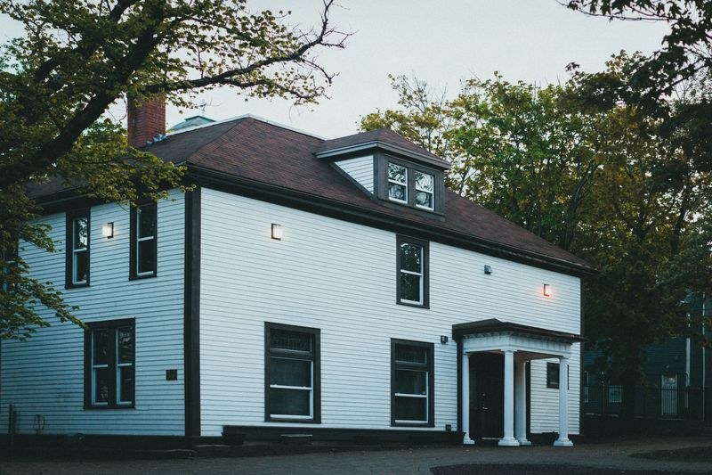 Michigan property at dusk behind a client testimonial