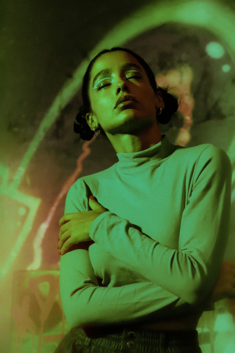 Green Toned Image Of Woman With Closed Eyes