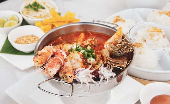 Delicious seafood hotpot with prawns, squid, and crabs in a spicy broth, ready to serve.