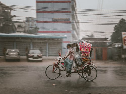 Rickshaw on the Road During Rainy Day