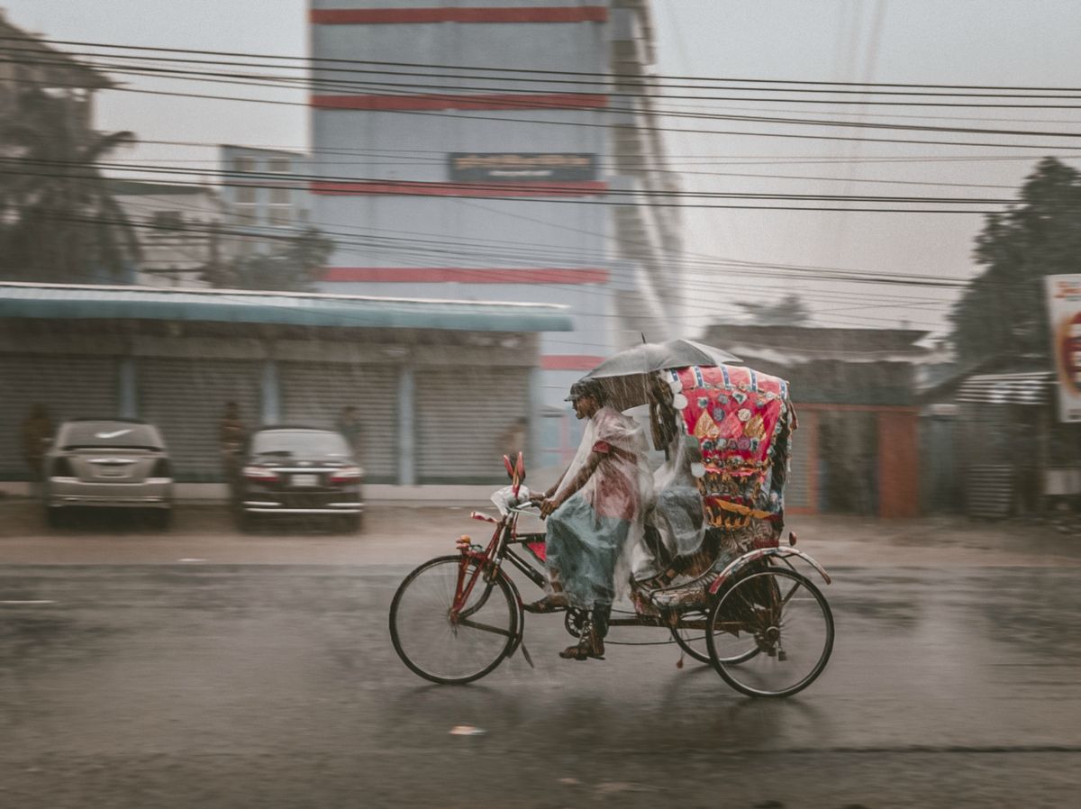 Heavy rain falling on a street in Thailand during the monsoon season