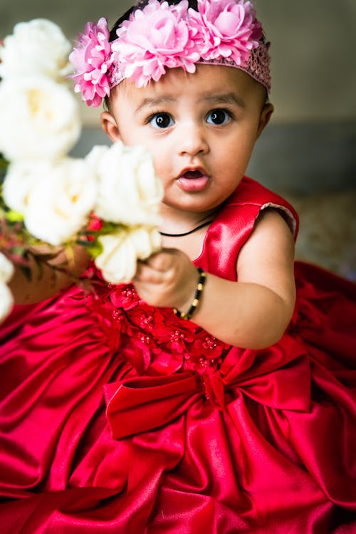 Free Close-up Photo of a Cute Toddler in Red Dress Stock Photo