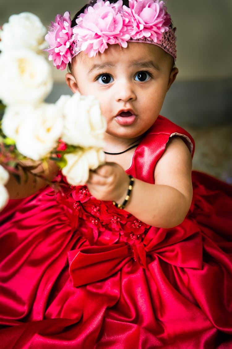 Close-up Photo Of A Cute Toddler In Red Dress