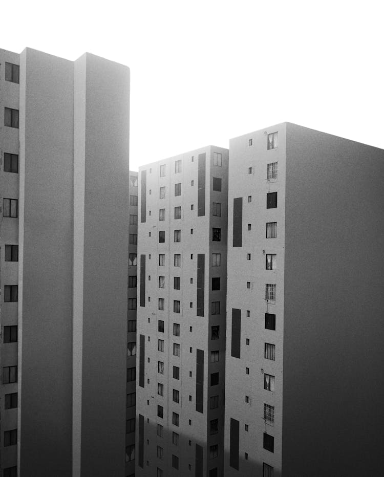 Grayscale Photo Of Apartment Buildings 