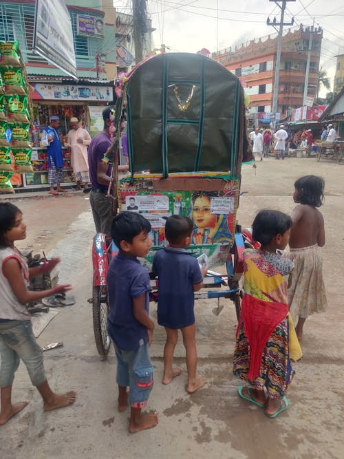 Free stock photo of asian kids, auto rickshaw, black kids