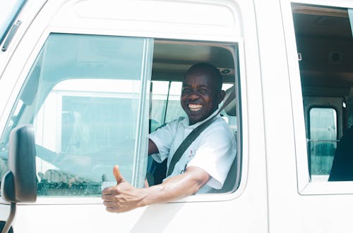 A Smiling Driver of a Utility Vehicle