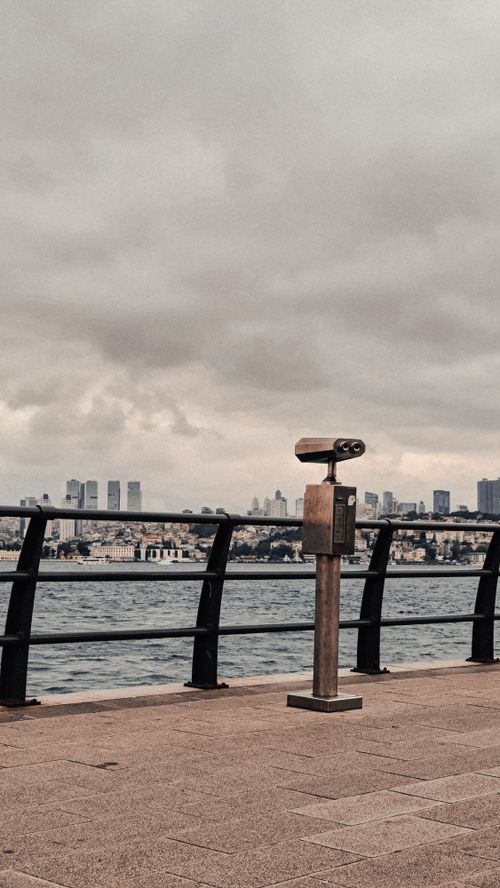 Free Explore urban skyline views across the waterfront with coin-operated binoculars available. Stock Photo
