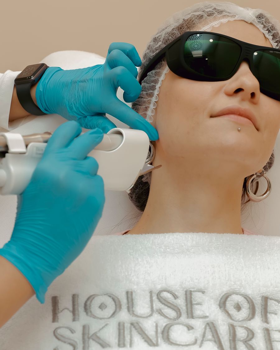 Patient wearing protective goggles during a laser toning session for sun spots at Bailor Clinic in Sinsa, Gangnam