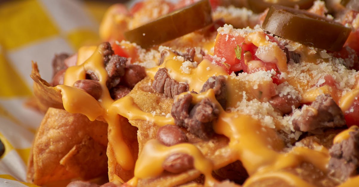 Restaurant Nachos With Fried Tortilla Chips, Melted Cheese, Sour Cream, And Fatty Meats